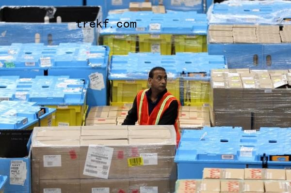 A worker moves products during Cyber Mo<em></em>nday at the Amazon's fulfillment center in Robbinsville, New Jersey, U.S., November 27, 2023. — Reuters pic