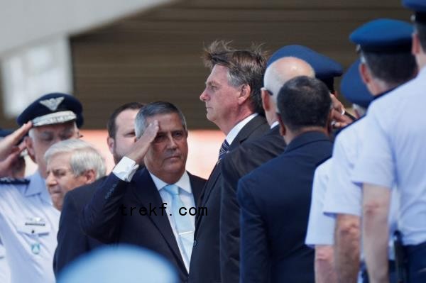 Brazil’s President Jair Bolso<em></em>naro looks on, as Brazil’s Defence Minister Walter Souza Braga Netto salutes him, during a military ceremony for the promotion of sergeants from Brazilian Air Force in Brasilia April 1, 2022. — Reuters pic  