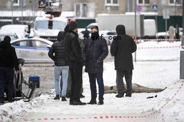 Investigators gather by a body at the blast scene, which killed the commander of Russian armed forces’ chemical, biological and radiation defence troops, Igor Kirillov, and his assistant, according to the Russian Investigative Committee, outside a residential building on Ryazansky Avenue in Moscow on December 17, 2024. — AFP pic