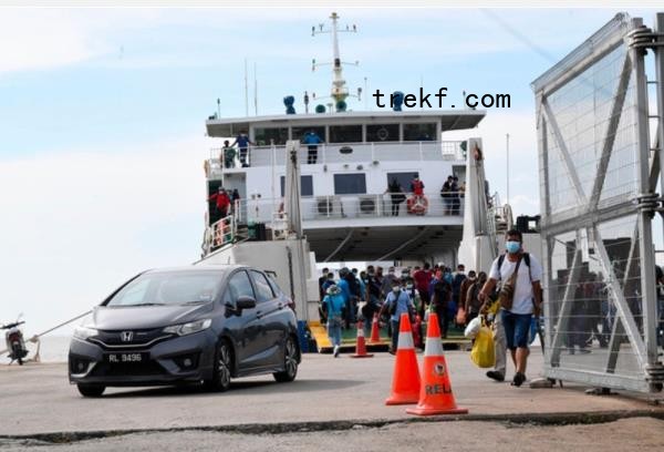 An undated file photograph shows passengers and vehicles disembarking from a ferry to Langkawi. — Bernama pic