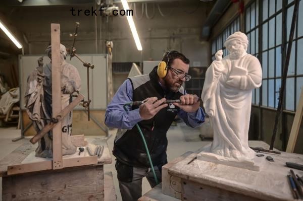 Sculptor Giovanni Calderino, 46, carves a Candoglia marble statue with a pneumatic hammer at Cantiere Marmisti, the marble yard wher<em></em>e marble from the Candoglia quarry is turned into ashlars, architectural and ornamental elements, sculptures and statues of Milan’s Duomo Cathedral, on December 11, 2024 in Milan. — AFP pic 